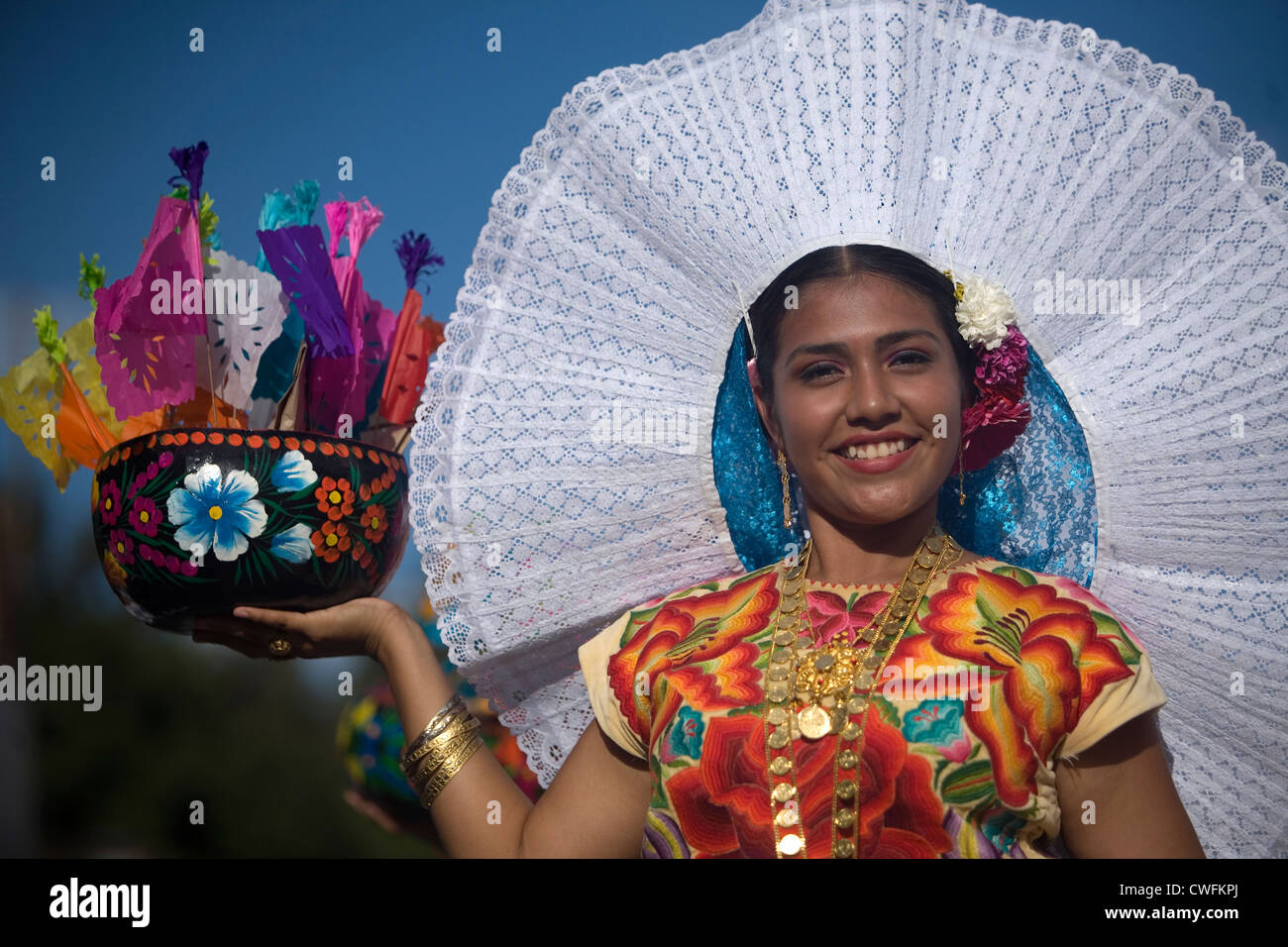 A Tehuana dancer smiles during the Guelaguetza parade in Oaxaca, Mexico. Stock Photo