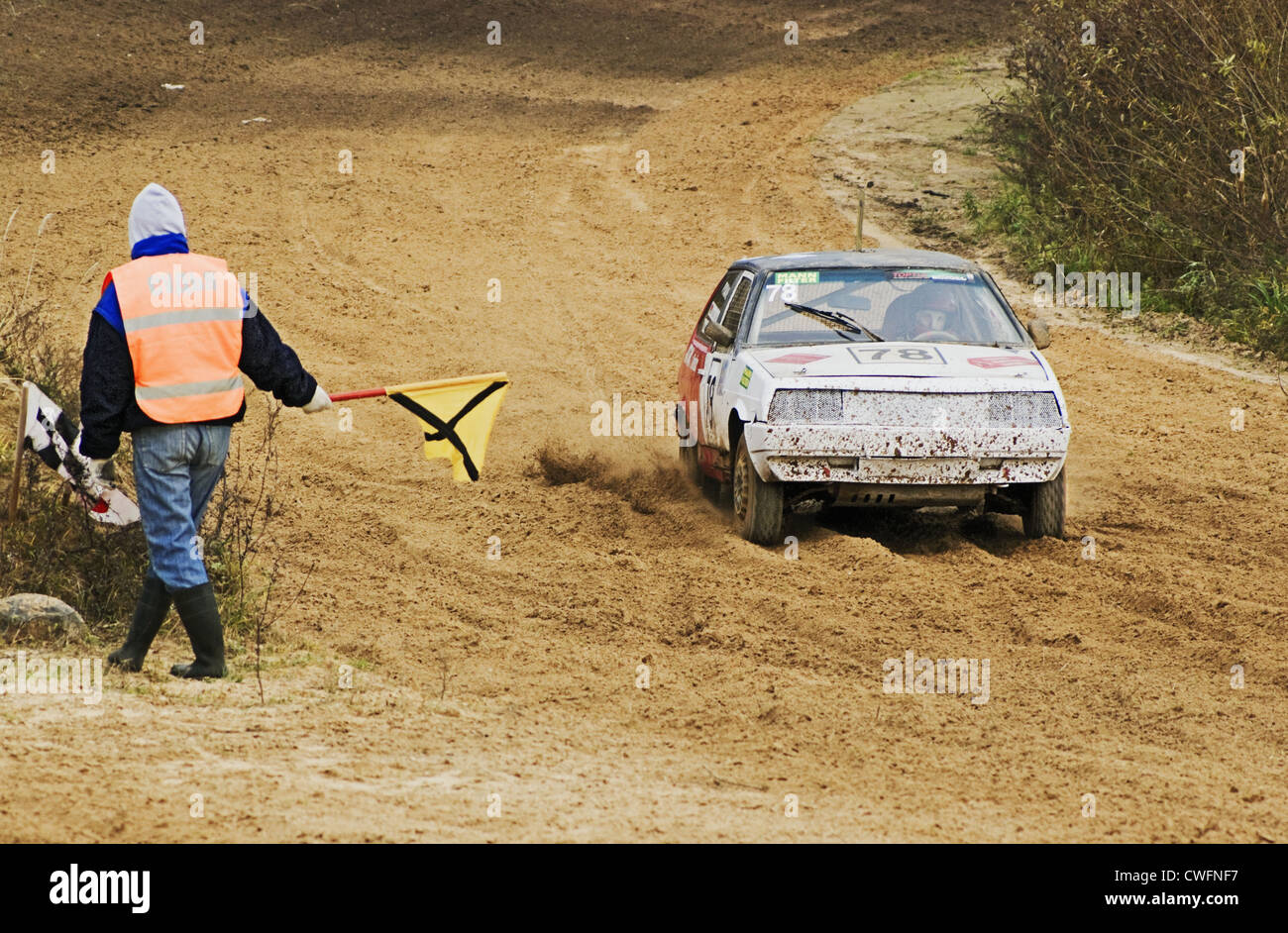 The judge signals a flag to the racing car Stock Photo Alamy