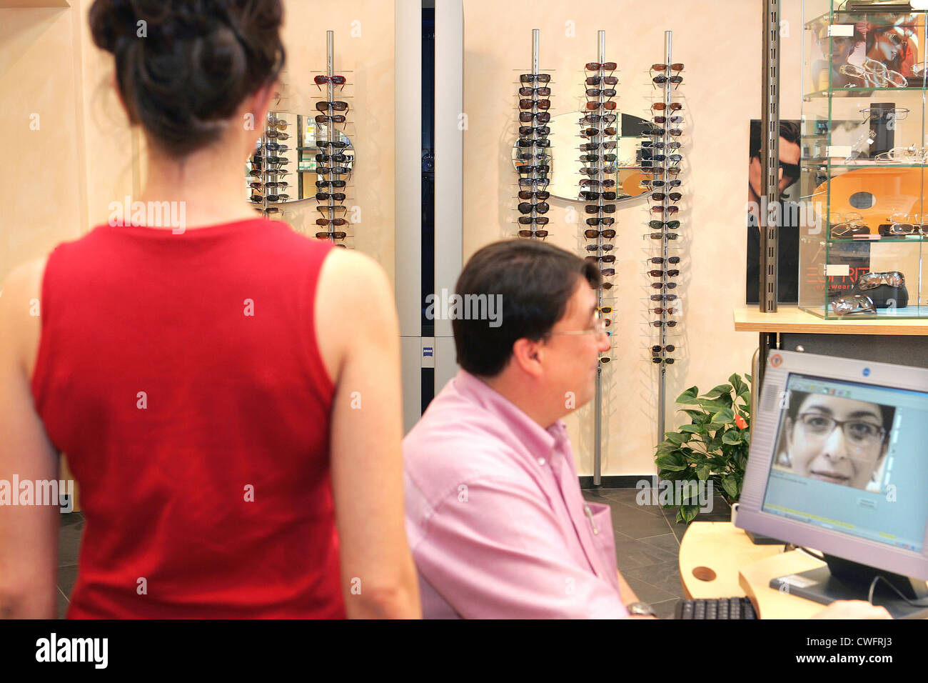 Video centration for glasses and replaced in an optician's shop Stock Photo