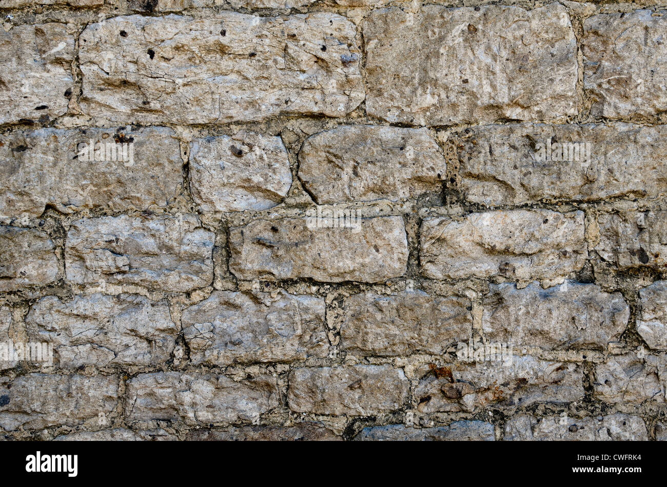 Stone building wall / detail of weathered stonework with lime mortar - western Wiltshire Stock Photo