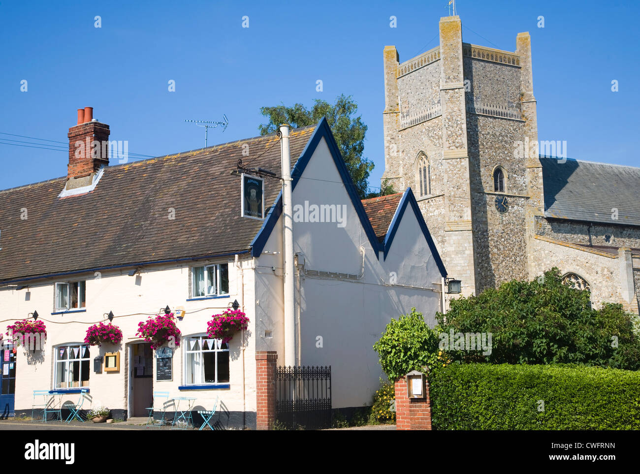 King's Head pub and St Bartholomew church Orford Suffolk England Stock Photo