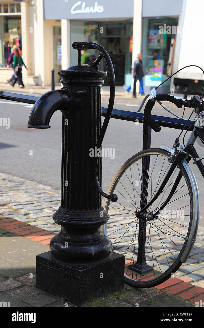 Water pumb and bicycle on High Street, Dorking, England Stock Photo