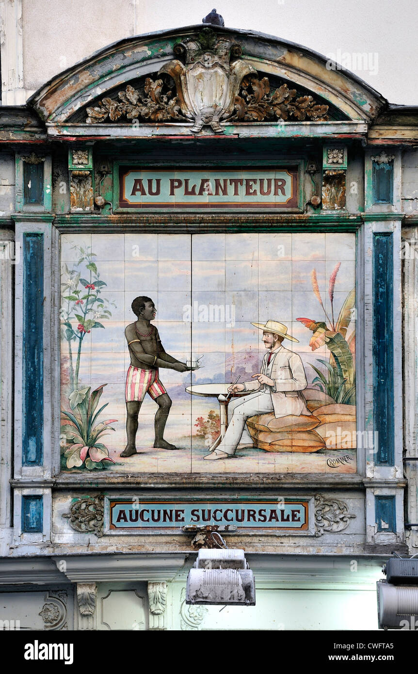Paris, France. Rue Montorgueil - old tiled sign. Plantation owner and black worker / slave? Stock Photo