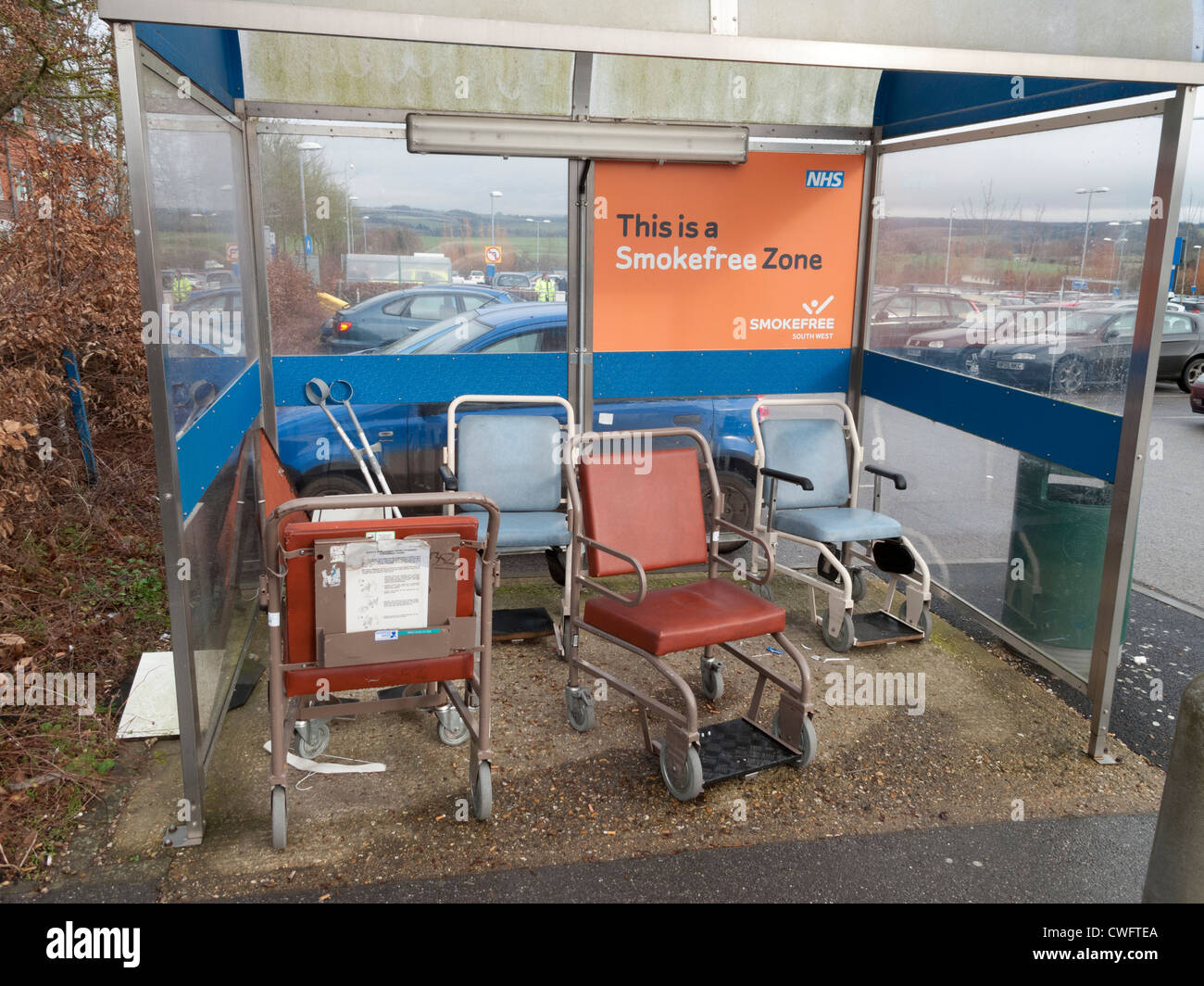Hospital Car Park shelter for returned medical appliances Wheelchair Wheel Chair Stock Photo