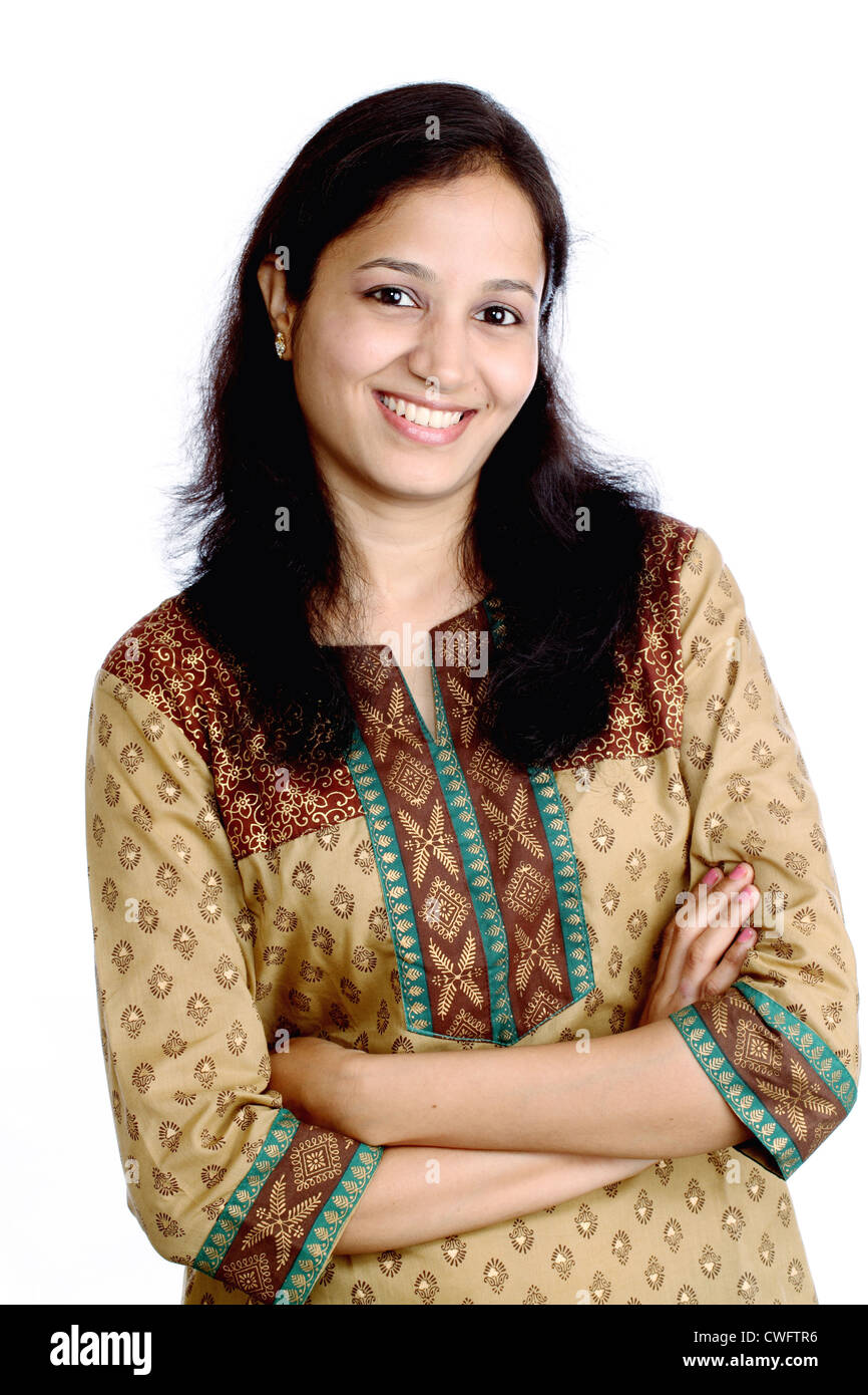 Arms crossed Beautiful Indian girl against white Stock Photo Alamy