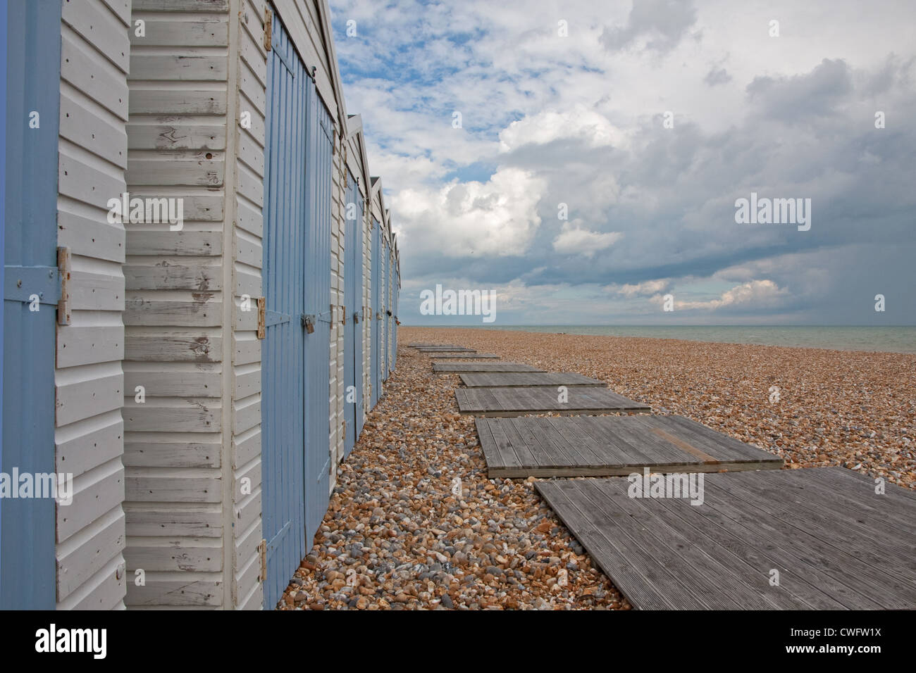 Beach huts on beach, Bexhill Stock Photo Alamy