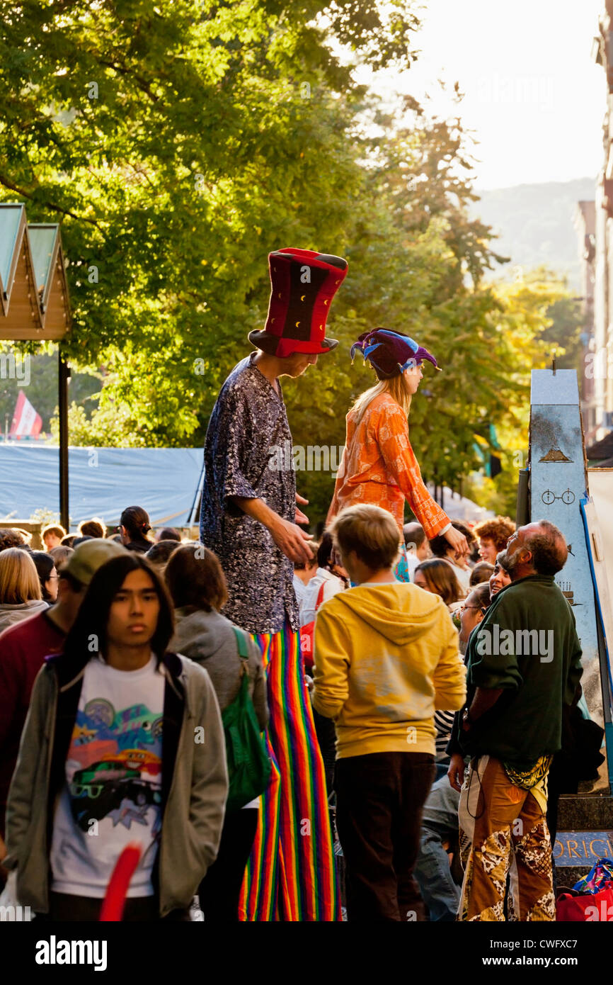 Stilt walkers performing at annual Apple Festival on The Commons in Ithaca, New York State Stock Photo