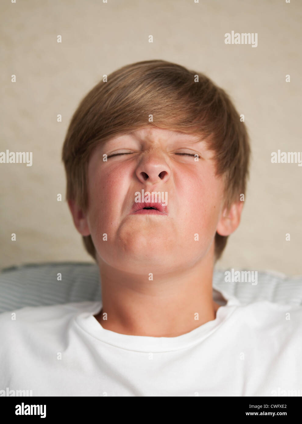 Boy pulling face Stock Photo
