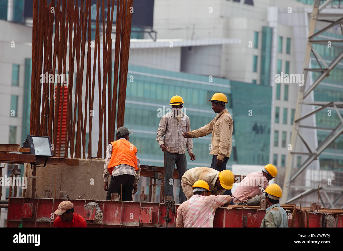 Workers at a construction site Stock Photo - Alamy