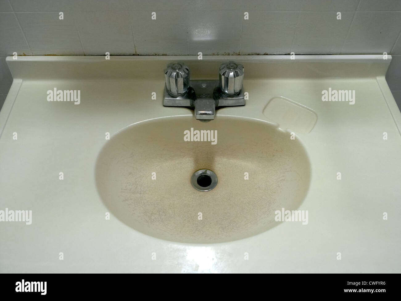 A faded worn plastic basin Stock Photo