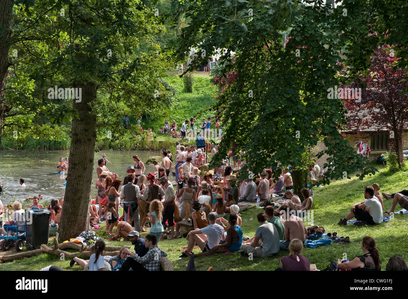 Crowds of festival goers gather by the lake at Wilderness music festival, Cornbury, Oxfordshire, UK Stock Photo