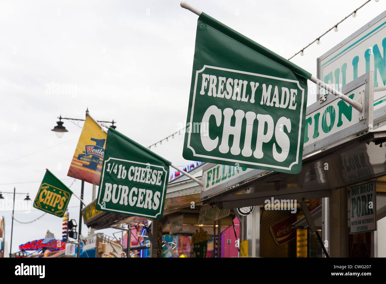 Whitby - north Yorkshire during the Regatta.  Fast food signs for chips and burgers Stock Photo