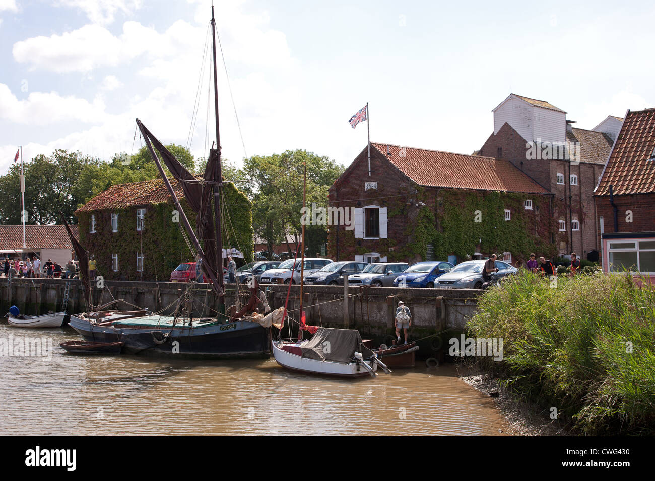 Snape Maltings,Suffolk,UK - associated with composer Benjamin Britten - with the barge Cygnet at the quay Stock Photo