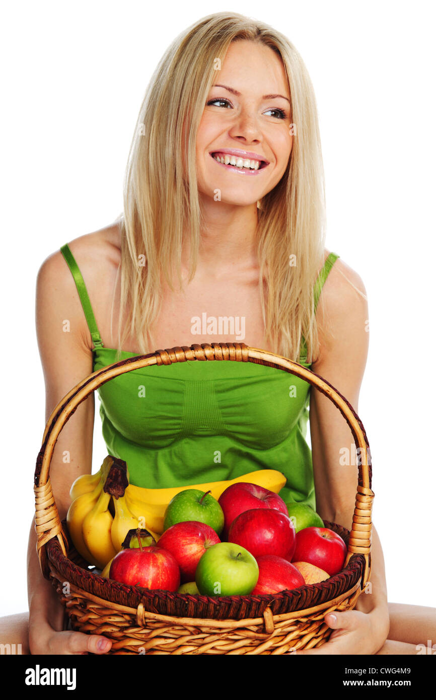 woman holds a basket of fruit on a white background Stock Photo - Alamy