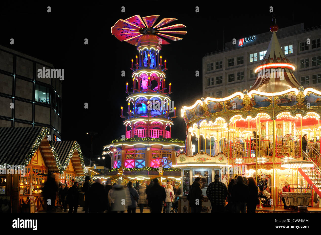Christmas market with merry-go-round and Christmas pyramid from Erzgebirge, Ore Mountains, Alexanderplatz square, Berlin Stock Photo