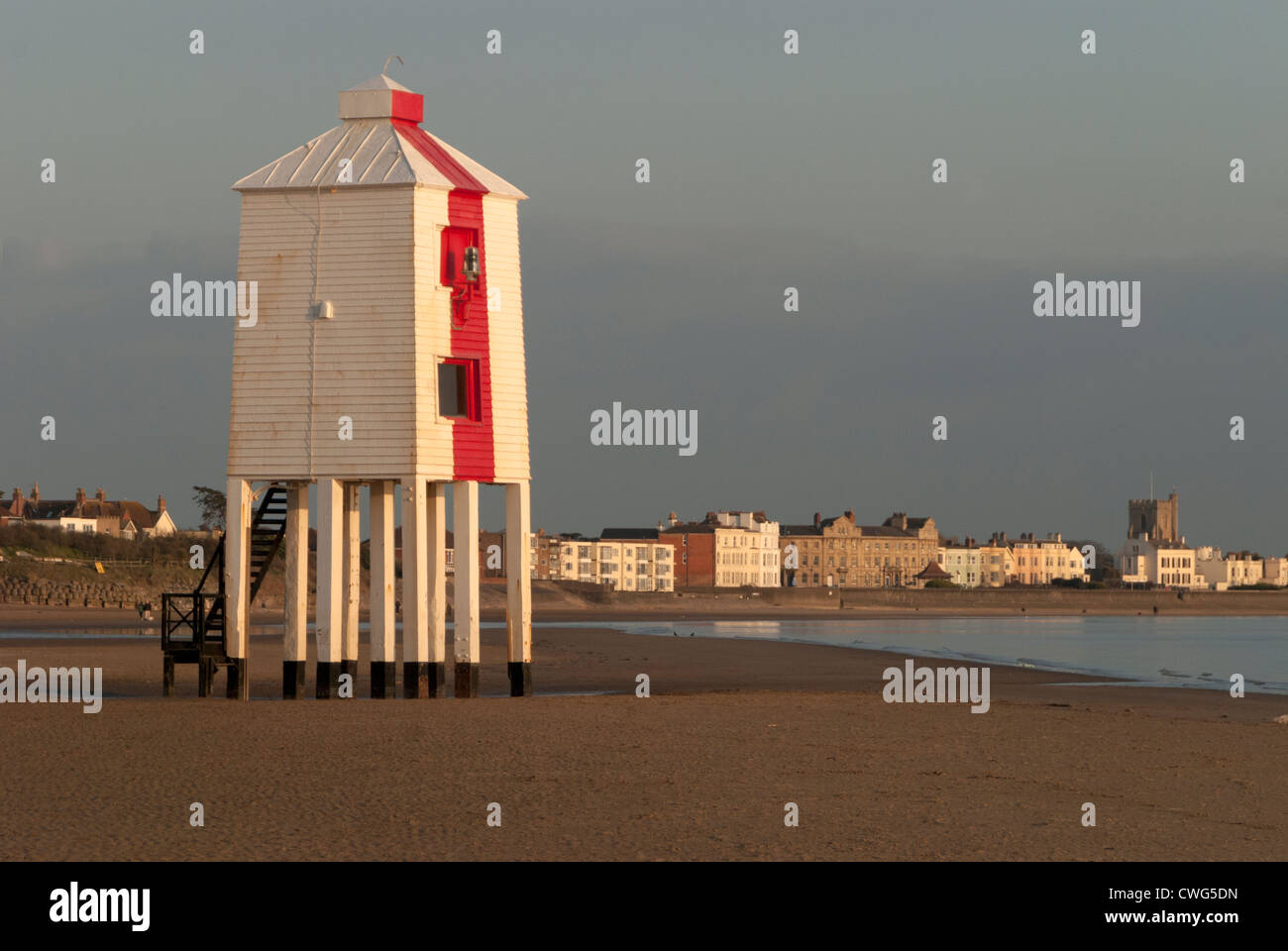 Red and white lighthouse at low tide, Burnham On Sea, Somerset Stock Photo