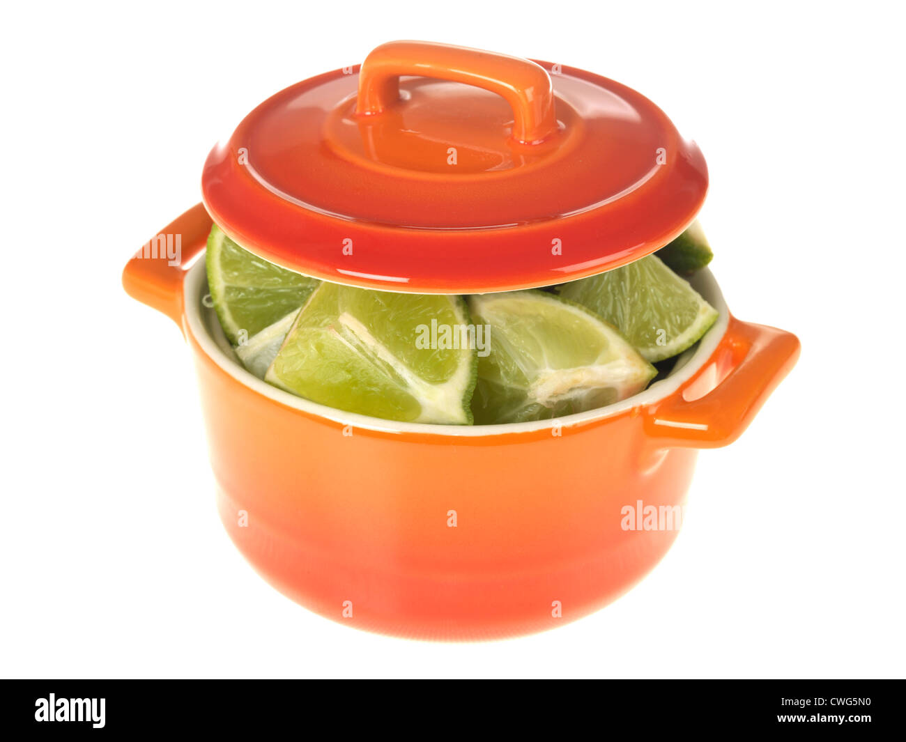 Colourful Orange Pot, Filled With Freshly Cut Ripe Green Limes Against White Background, With Clipping Path And No People Stock Photo - Alamy