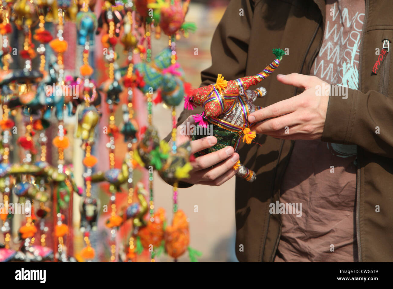 a buyer checking a traditional Indian handicraft in a craft market Stock Photo