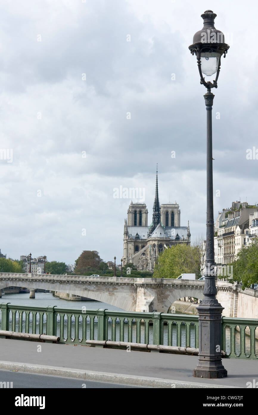 View of Notre Dame cathedral, with street lamp on the Pont de Sully