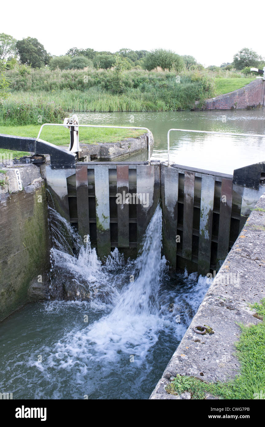 Water gushing between lock gates on the Kennet and Avon Canal in Wiltshire UK Stock Photo