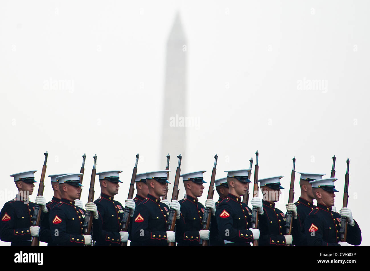 US Marines march around the Marine Corps War Memorial during a Tuesday Sunset Parade in Arlington, Virginia on August 14, 2012. Stock Photo