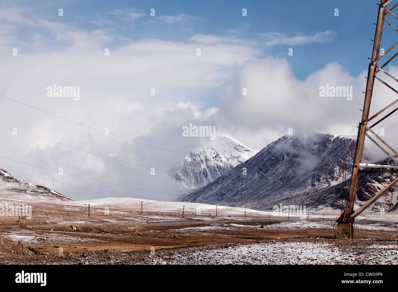 Power line in Barskoon valley in Kyrgyzstan, high Tyan Shan mountains Stock Photo