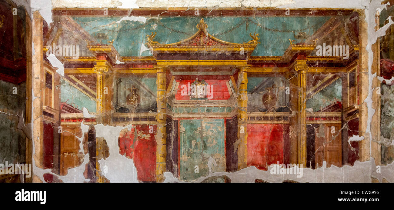 Frescos at the Villa di Poppaea at the Roman site of Oplontis, a resort, showing a grand facade with columns behind. Stock Photo