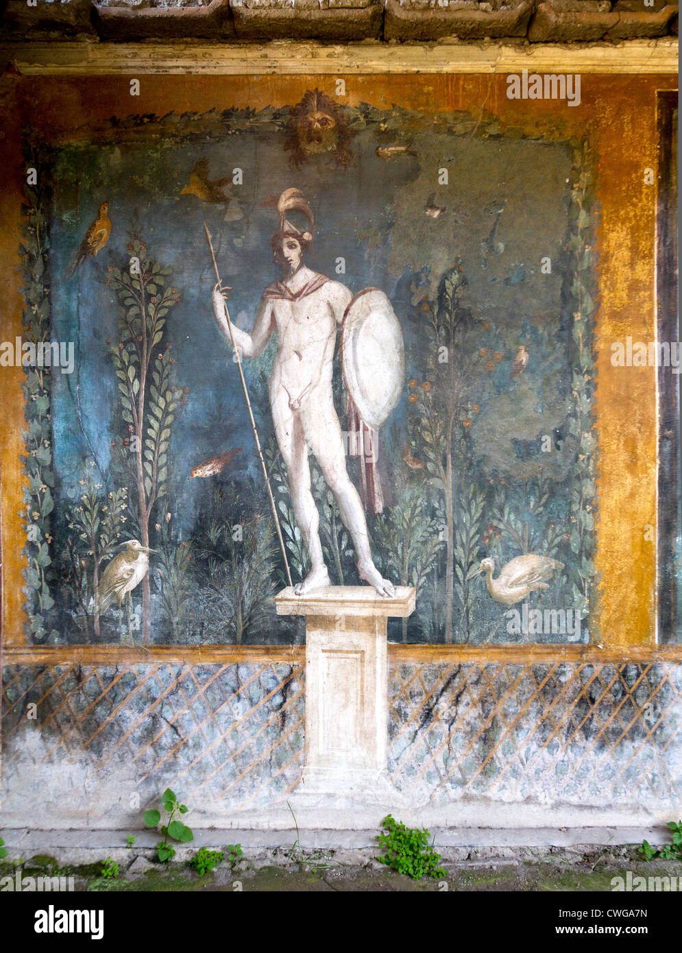 Ancient Roman mural at the Roman city of Pompeii showing the God Mars in front of a garden (at the House of Venus in the shell) Stock Photo