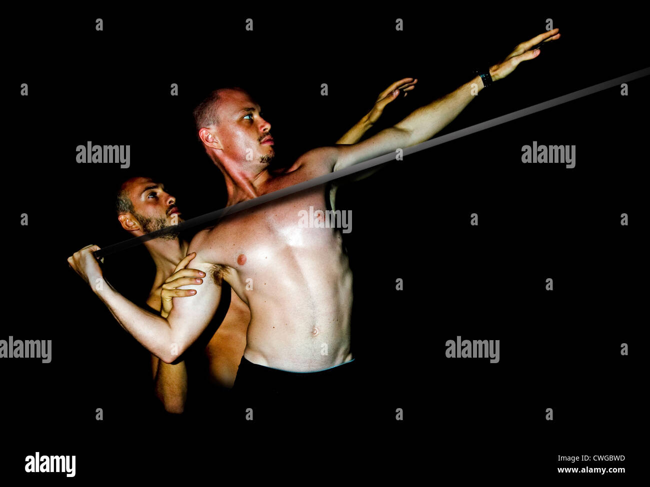 men throwing a spear Stock Photo