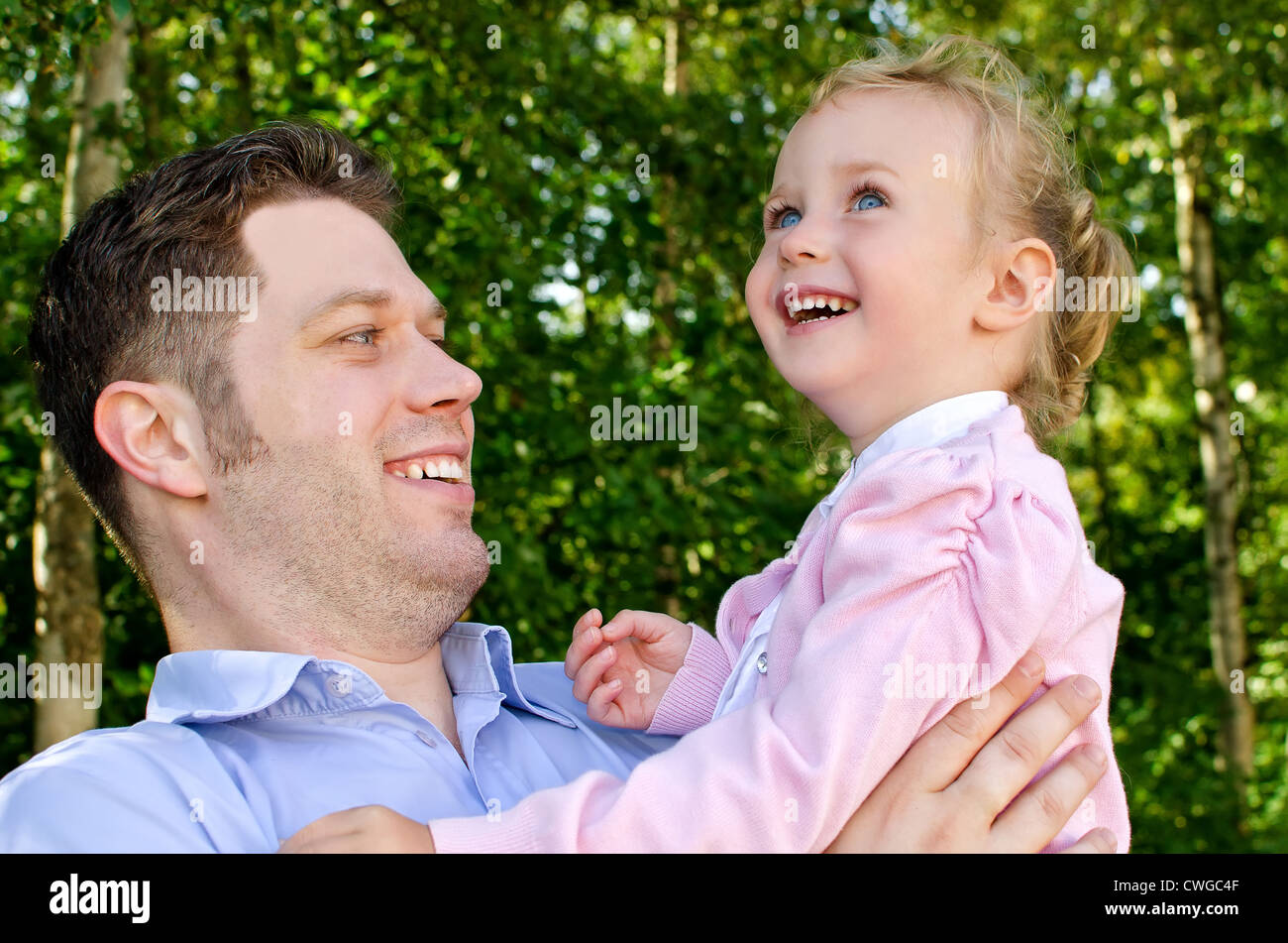 Father and daughter having fun in the park stock photo alamy