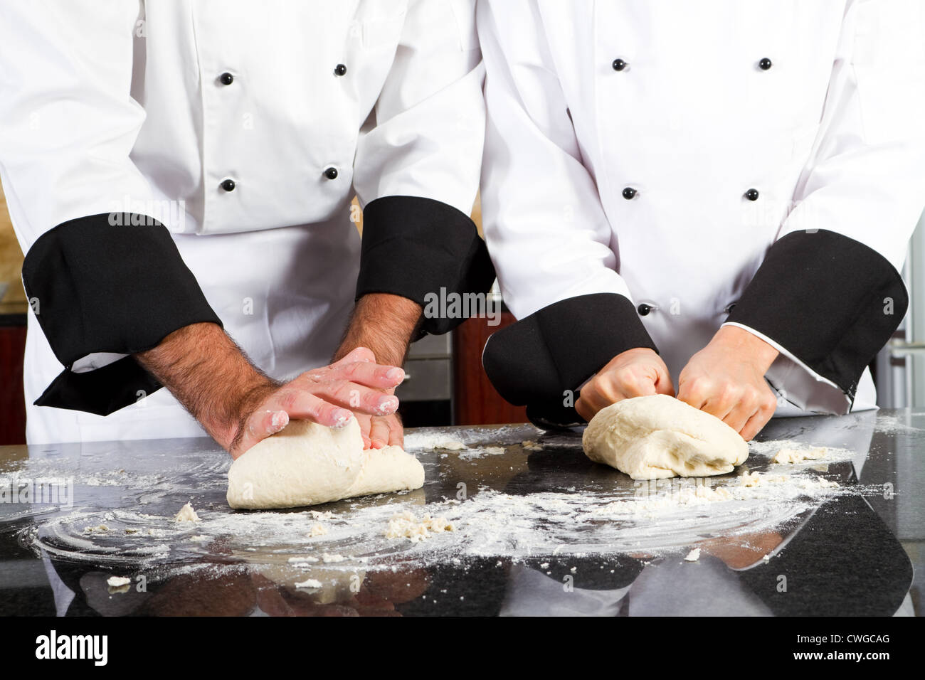 professional chef hands kneading bread dough on kitchen counter Stock ...