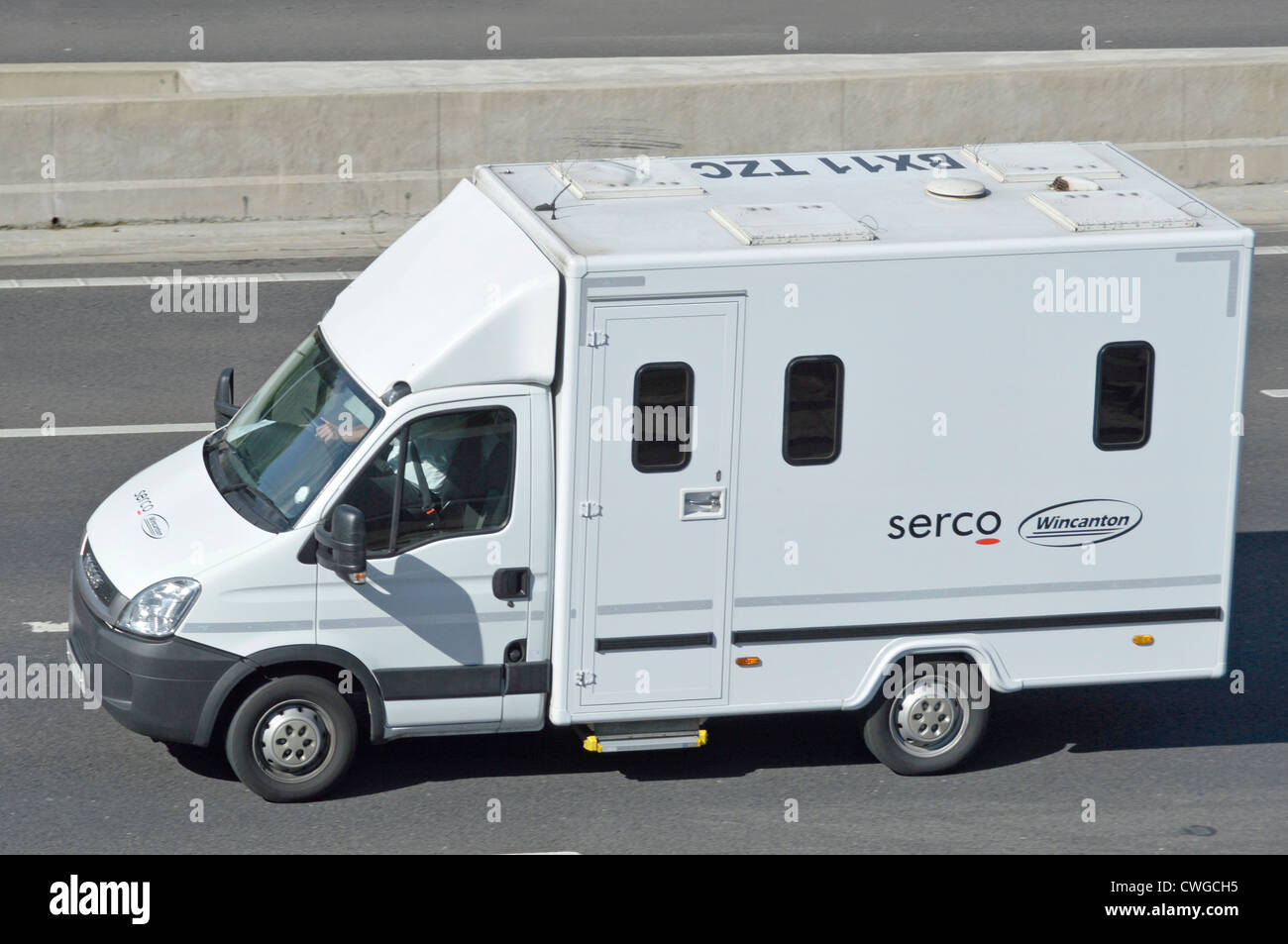 Aerial view prisoner transporting van operated under joint venture business by Serco & Wincanton truck lorry transport & logistics company UK motorway Stock Photo