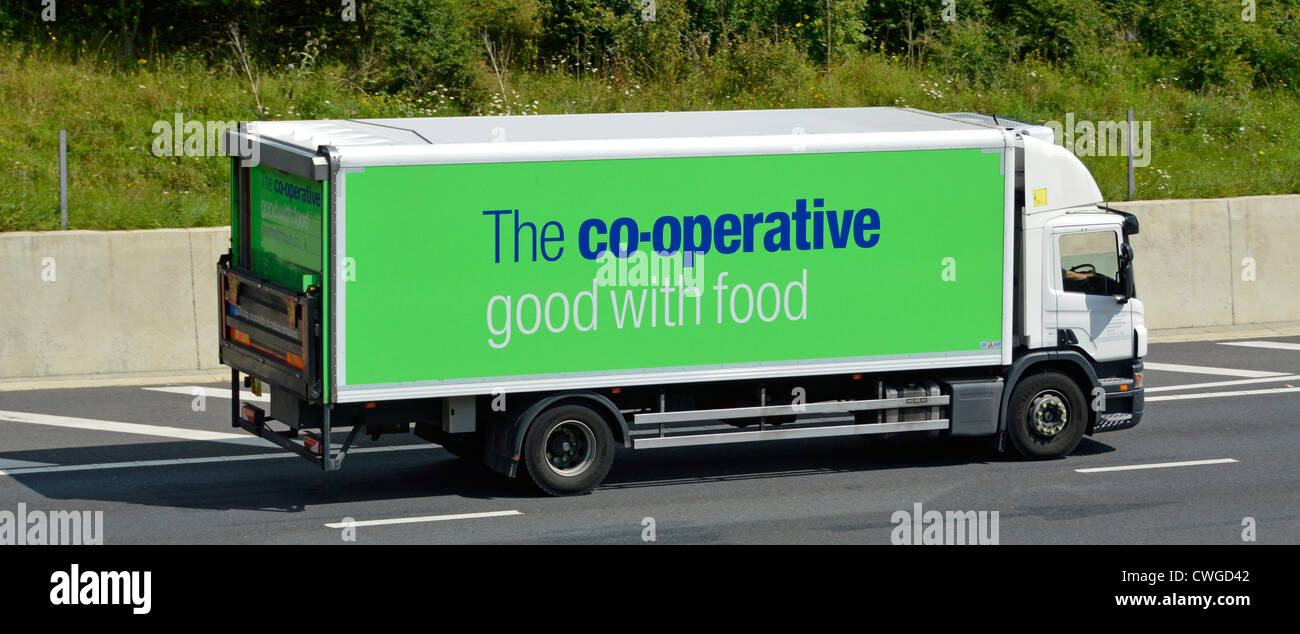 Co op food supply chain store delivery hgv lorry truck used for food distribution to co operative supermarket stores driving along motorway England UK Stock Photo