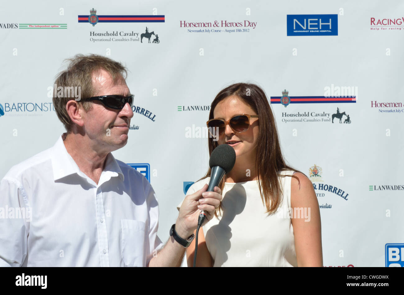 TV interview at horse racing Stock Photo Alamy