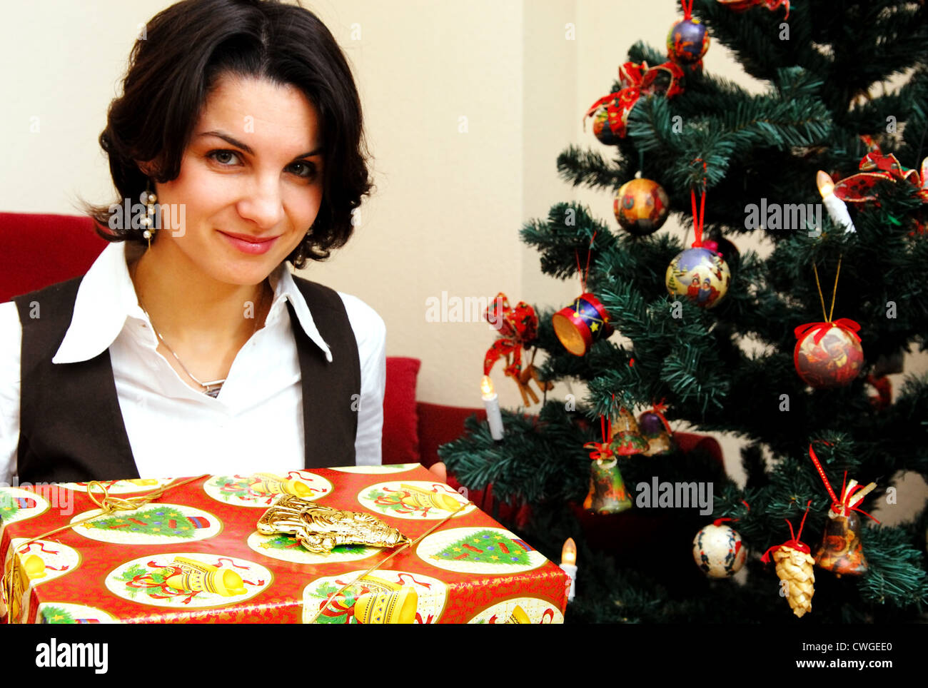 Berlin, a young woman with christmas gift Stock Photo