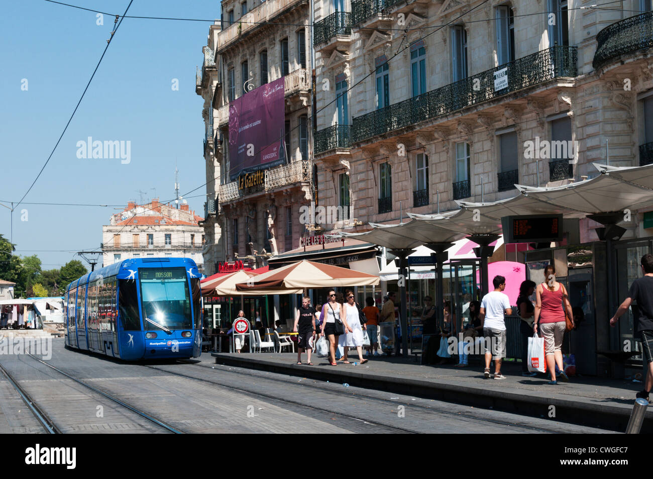 A tram at the stop in the Place de la Comédie, Montpellier, France. Stock Photo