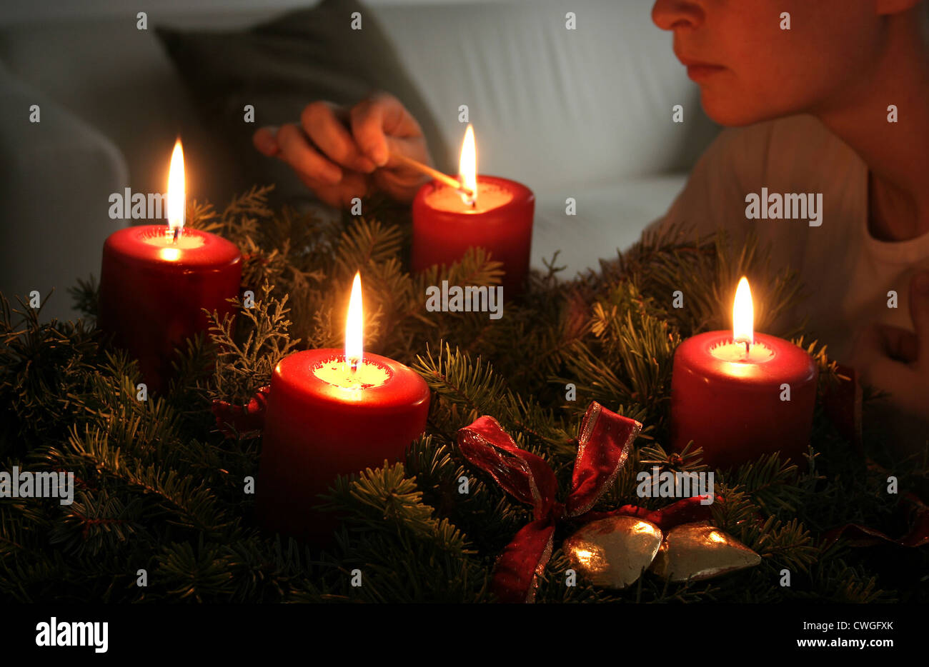 Ms. builts the fourth candle on the Advent wreath Stock Photo Alamy