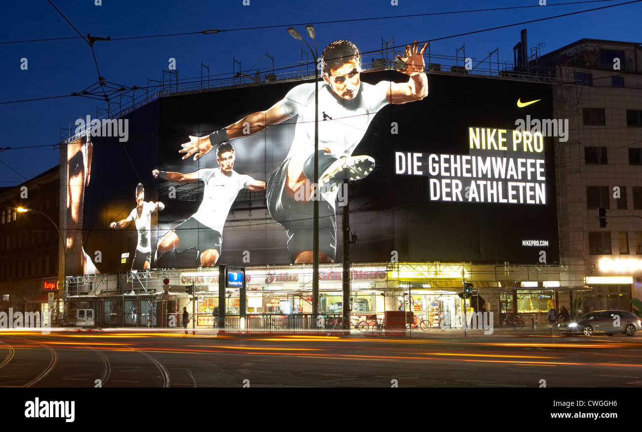 Berlin - Giant illuminated billboard for Nike from a drainpipe Stock Photo  - Alamy