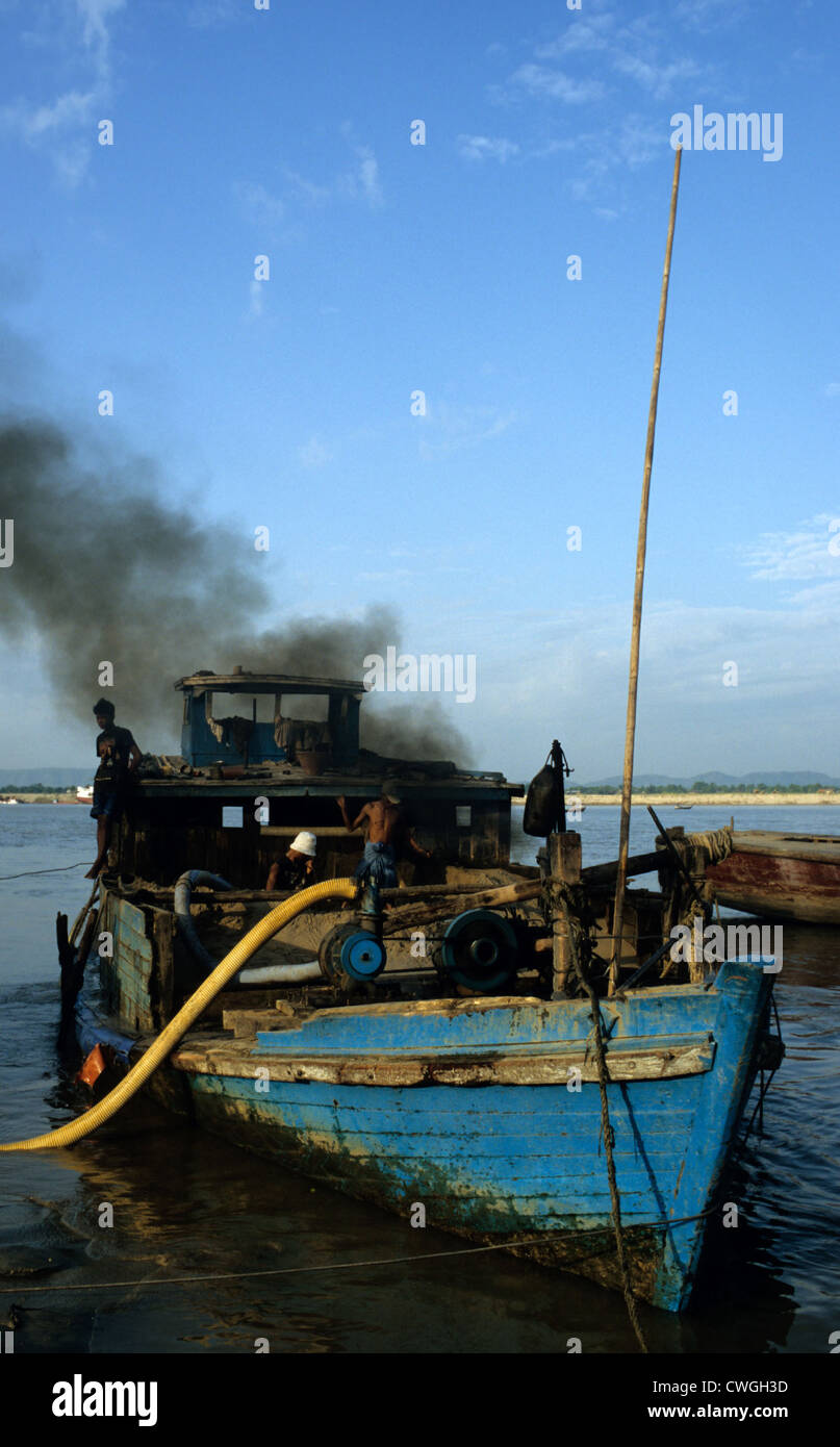 Cargo ship on shore Ayeyarwady Stock Photo