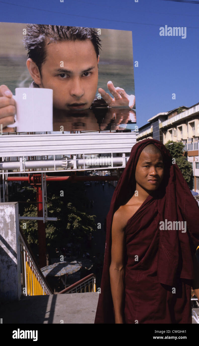 Young monk in front of a cafe-poster Stock Photo