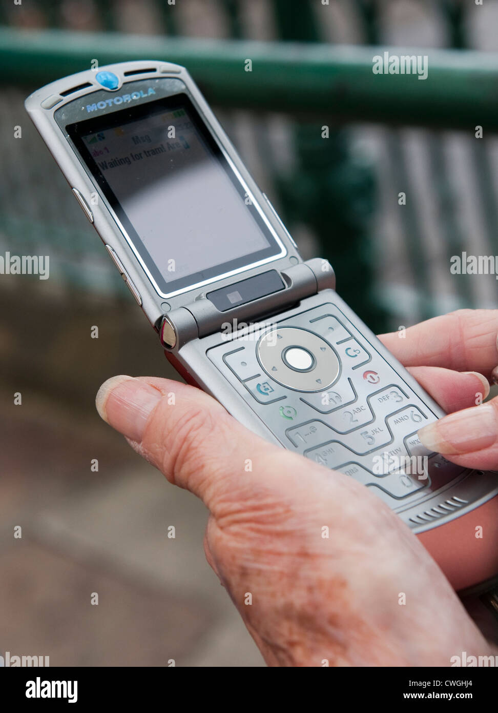 Close up of a person holding a mobile phone. Stock Photo