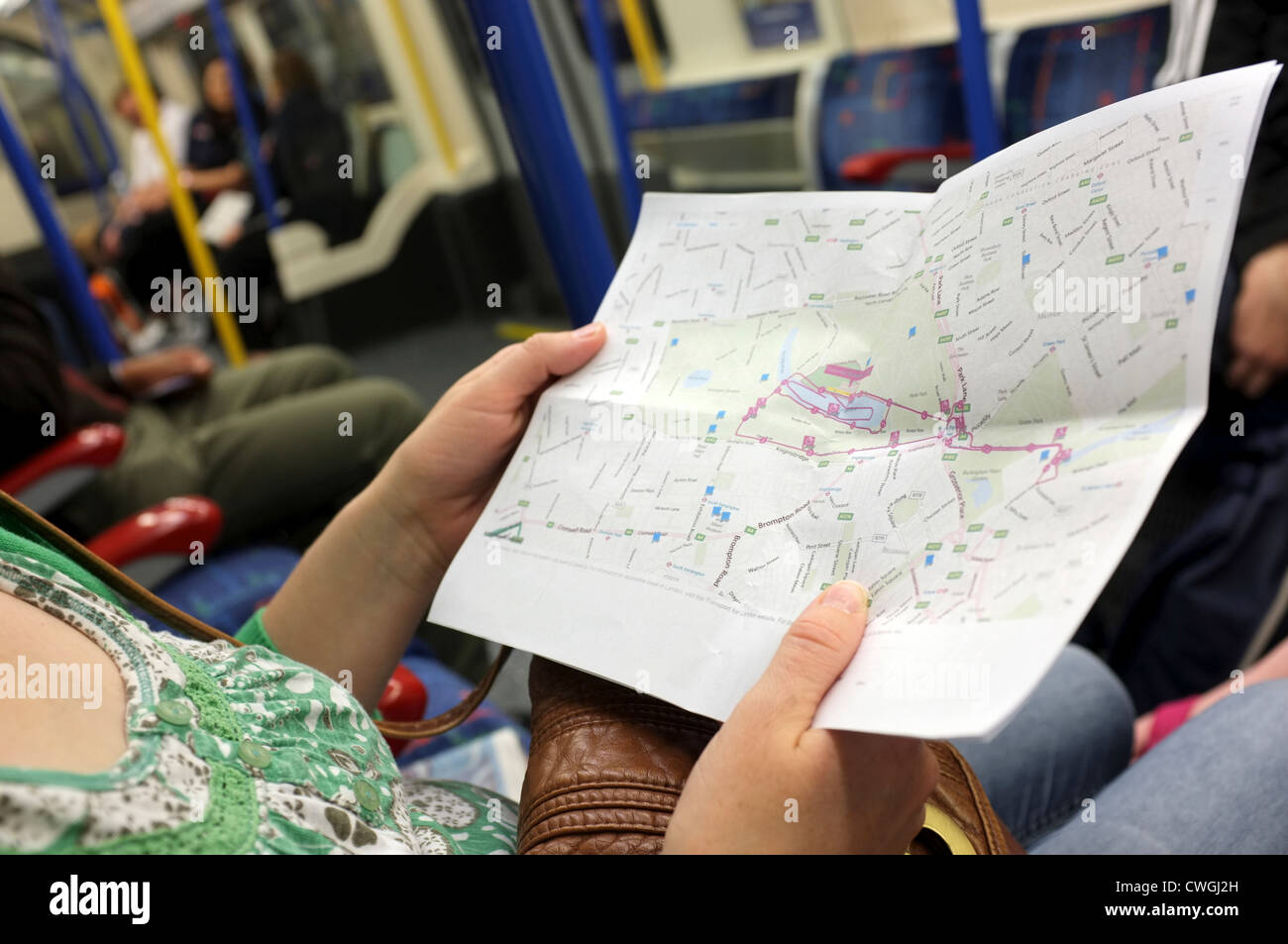 woman looking at map of Olympic triathlon course London 2012 Stock Photo