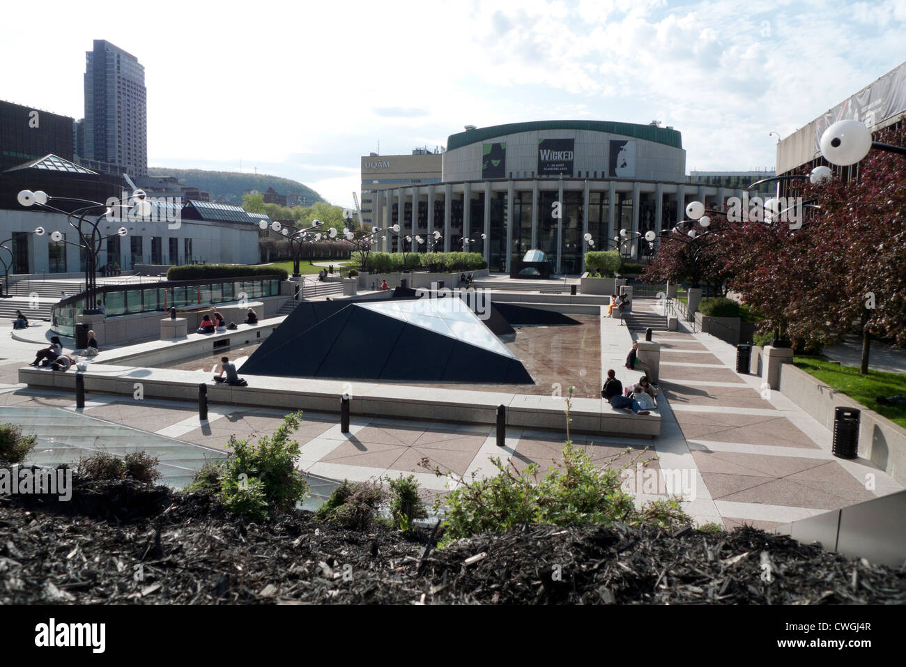 People relaxing at La Place des Arts Art Centre Center complex Montreal