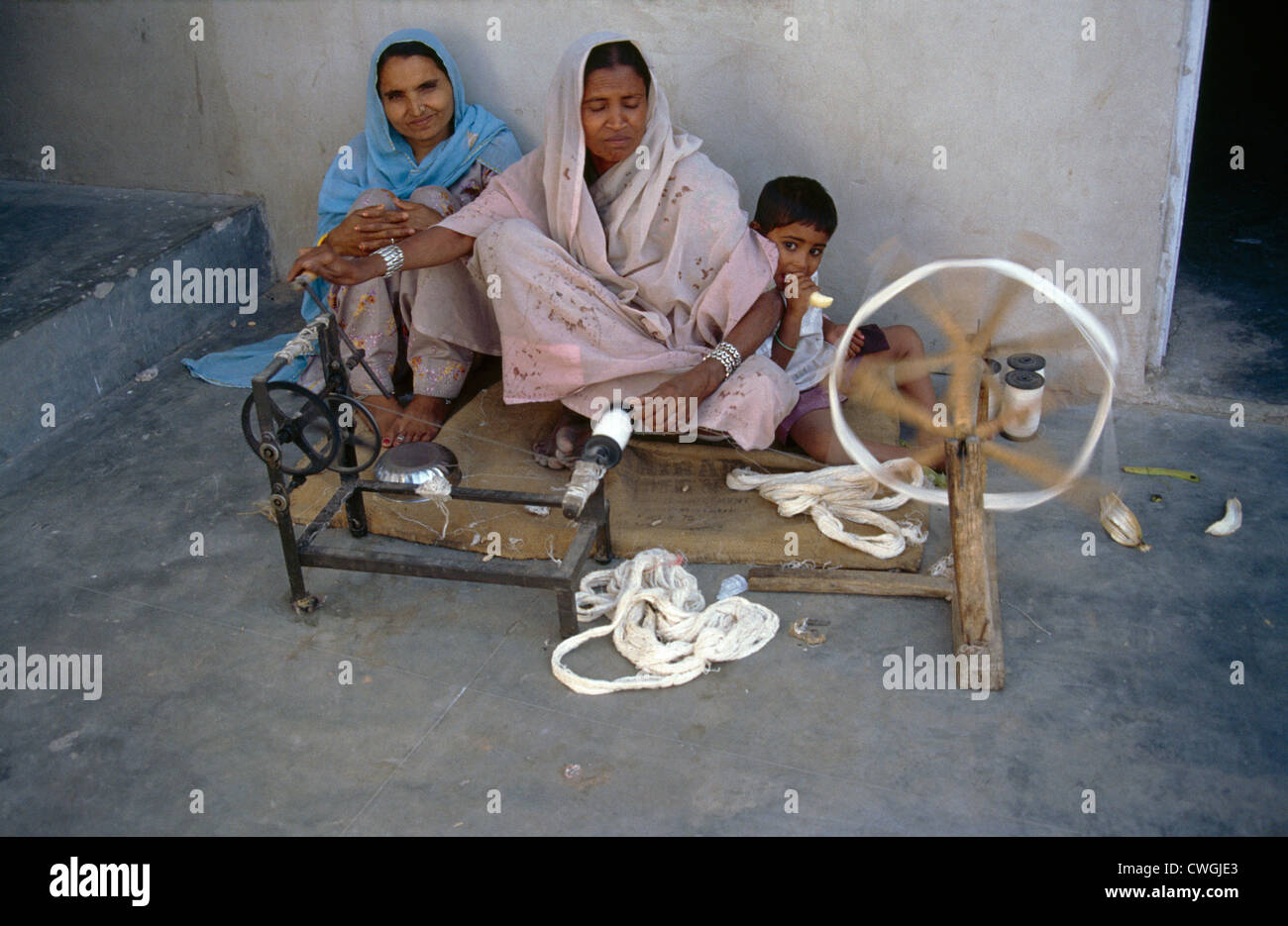 Jaipur India Leper Community Spinning Cotton For Weaving Stock Photo