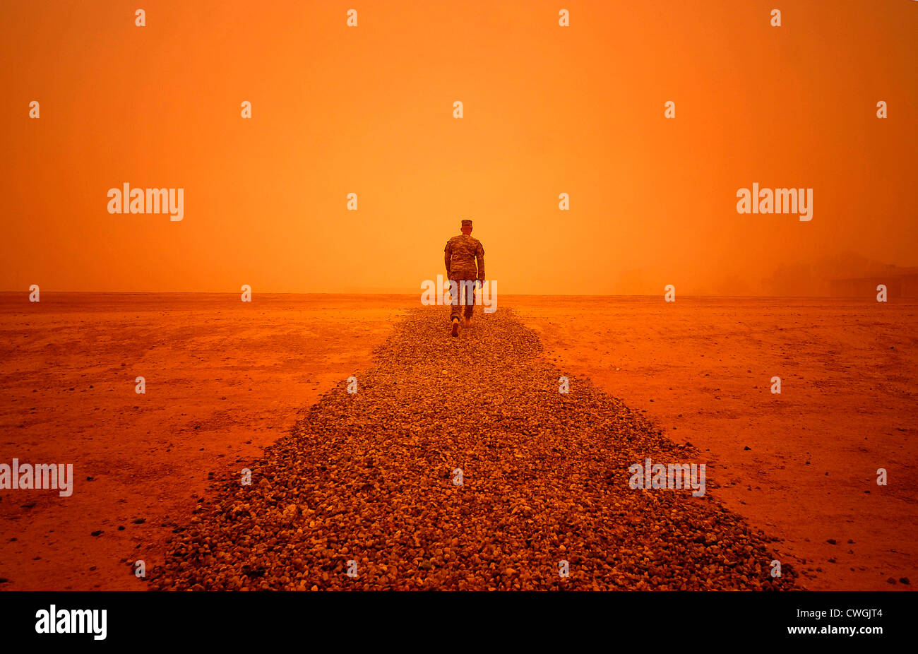 A US Airman braves a sandstorm after leaving the 9th Air and Space at Al Asad Air Base, Iraq, September 27, 2011. Stock Photo