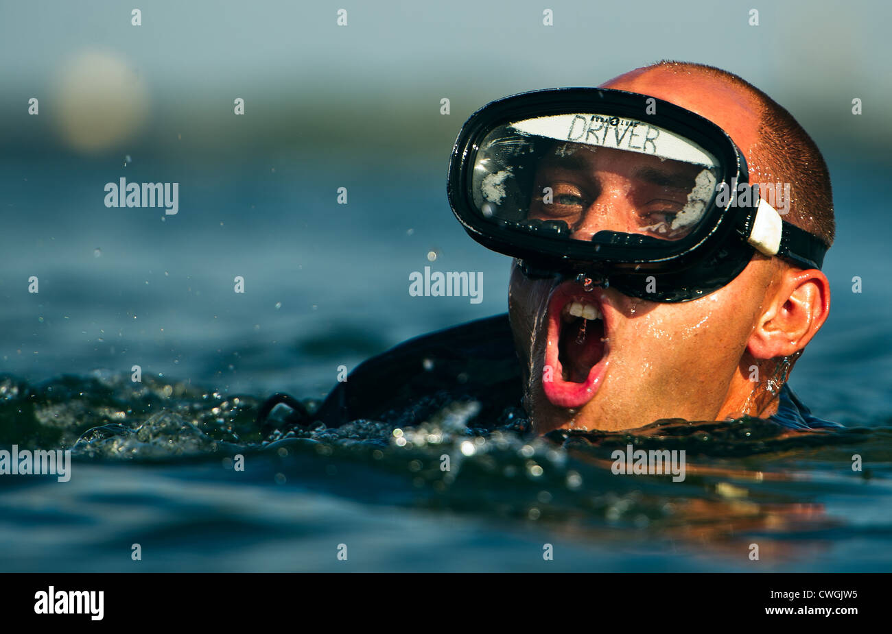 An Air Force Pararescue Jumper trainee swims to the finish point August