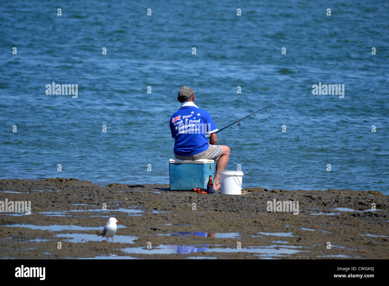 Man sitting on bucket fishing hires stock photography and images Alamy
