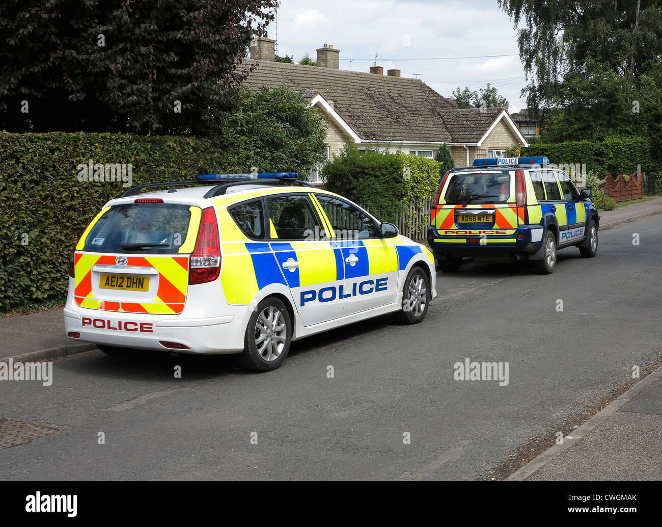 Two police cars parked in street Stock Photo