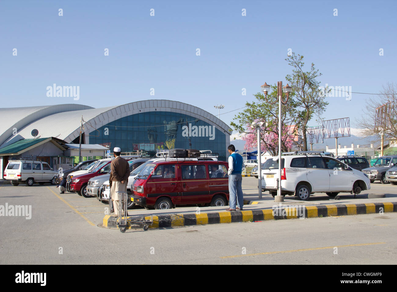 View of Srinagar airport and taxis outside. This is a high security area due to the history of terrorism in Kashmir. Stock Photo