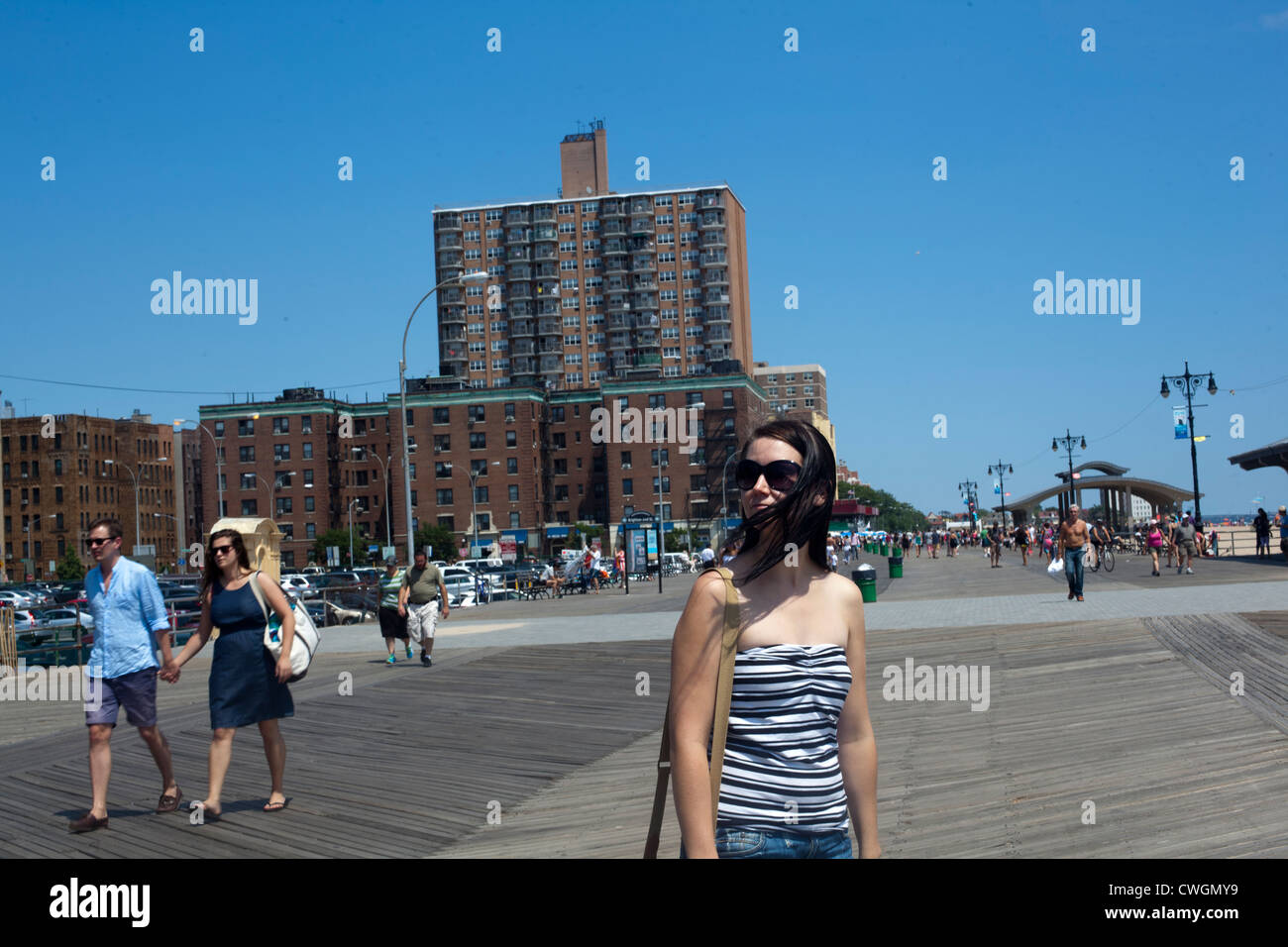 Girl on the board walk of Coney Island Brooklyn New York City on a hot